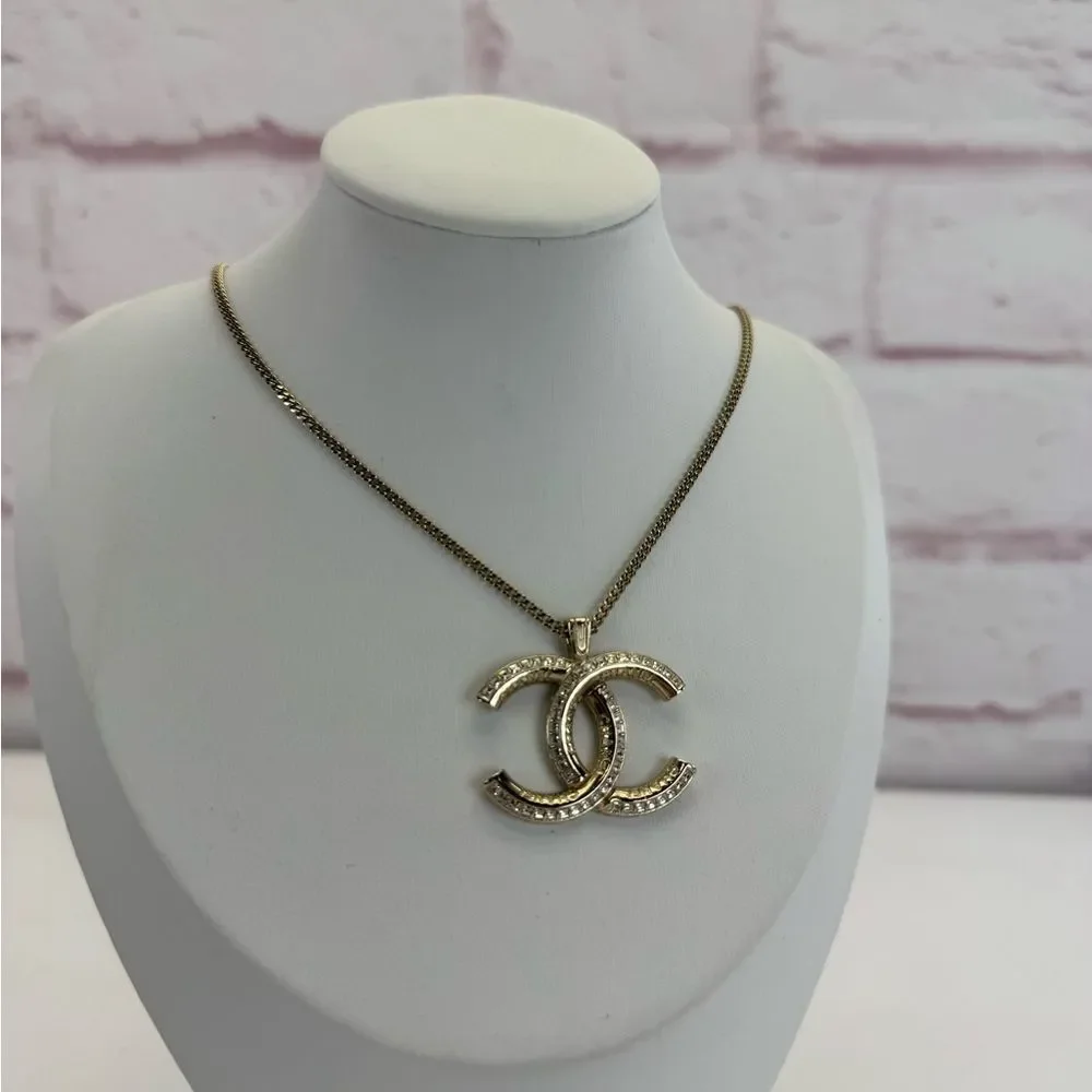 CHANEL Multi Logo Engraved Gold Crystal CC Pendant Necklace